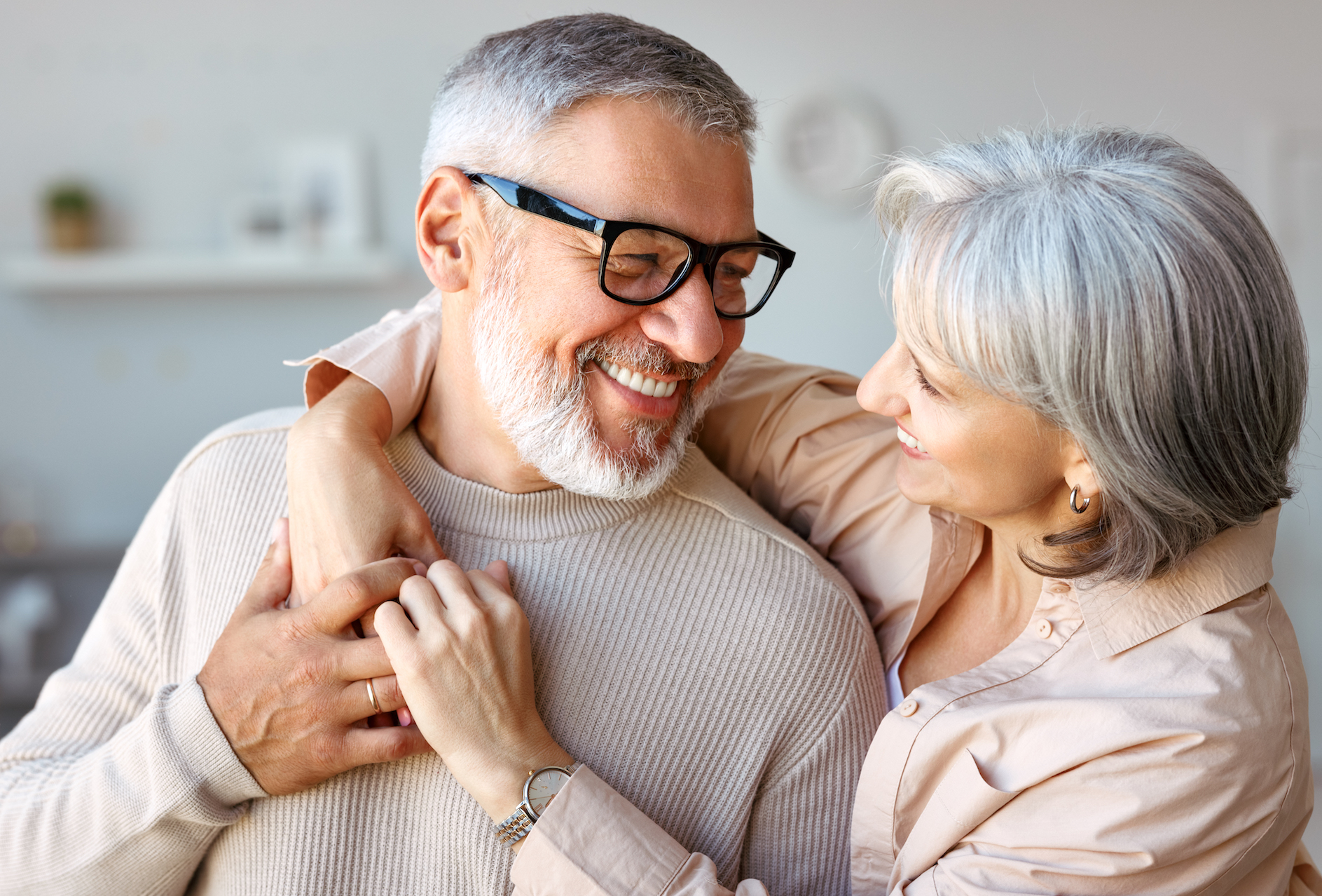 Beautiful smiling senior family couple husband and wife looking at each other